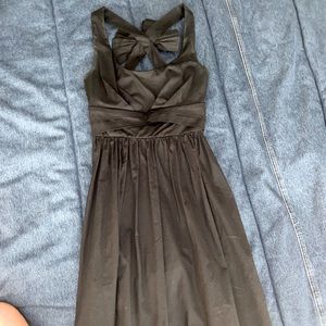 Black mini stress with a bow on the back
